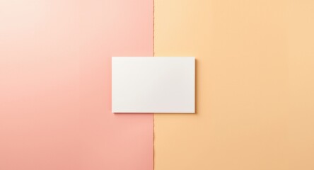 Fototapeta premium Clean white card displayed on warm pink and yellow dual toned background