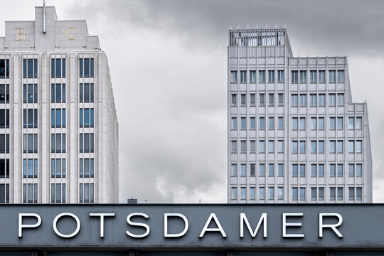 Potsdamer Platz sign in Berlin Germany with modern building facade architecture and skyline text under soft daylight in the city