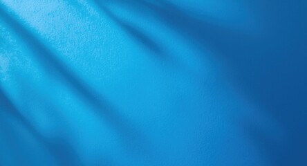 Blue matte surface background featuring gentle shadow and copy space