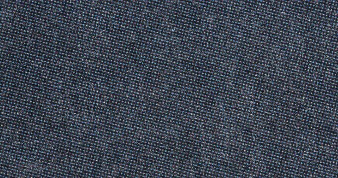 Stop-motion style close-up of dark paper with ink halftone print pattern and tiny dots. Printed texture background for editorial design, overlays, transitions, or looping footage.