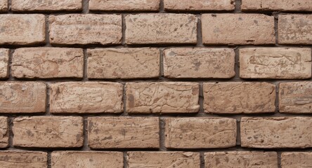 Obraz premium Detailed closeup of a brown brick wall with rectangular brickwork patterns and visually rich texture