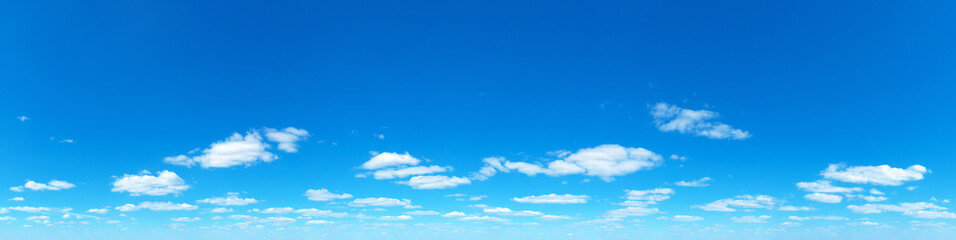 Obraz premium Blue Sky background with tiny Clouds. Panorama background