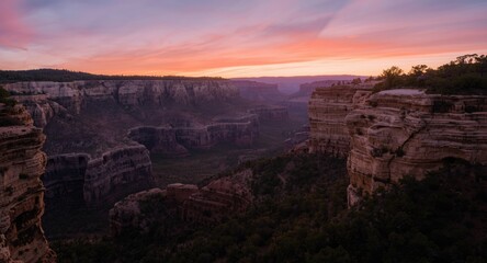 Fototapeta premium Idyllic canyon vista framed by a radiant evening sky
