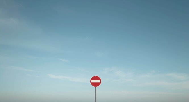 Clear sky featuring no entry sign and open space for placing text