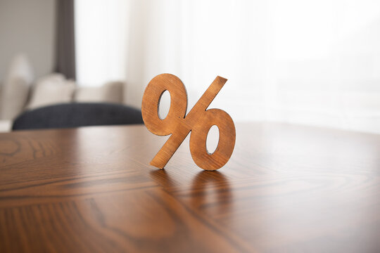 wooden sign of percent