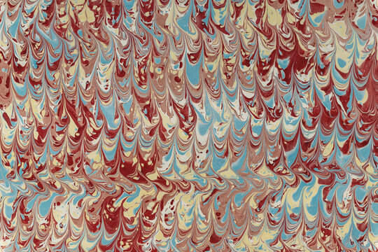 Abstract marbled paper pattern with colorful fluid texture creating background