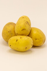 A small pile of fresh, raw potatoes ready for cooking or storage, providing a versatile ingredient for various meals.