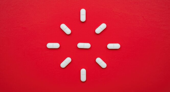 Ivermectin drugs arranged on red paper symbolizing parasite infection relief alongside off label Covid19 therapy