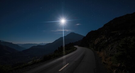 Idyllic nighttime mountain road touched by silver moon rays