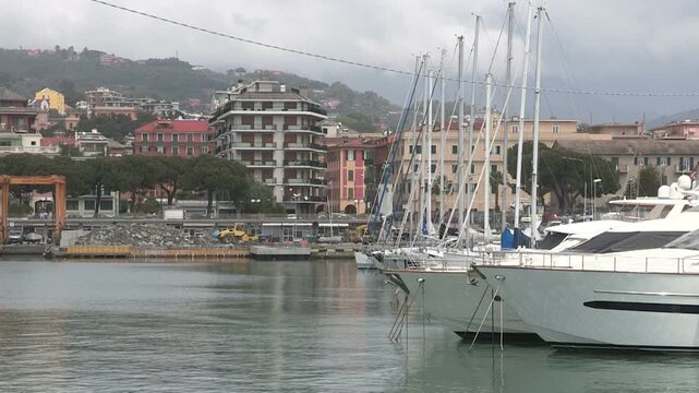 Side view of prows of boats moored in the port of Chiavari