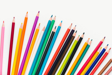 Fototapeta premium Colored pencils on a white background. Background of multicolored pencils.