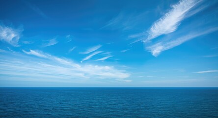 Bright blue sky gently meeting the ocean surface with thin clouds and a clear horizon © AbstractAI