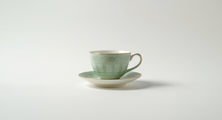 Fototapeta premium Distinctive green tea cup and saucer ensemble on plain white background