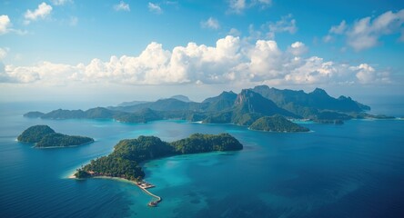 Fototapeta premium High angle shot of flourishing islands with soft clouds on a calm summer afternoon