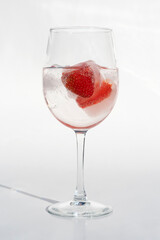 Fruits in a clear glass  on a white background