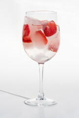 Fruits in a clear glass  on a white background