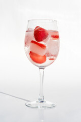 Fruits in a clear glass  on a white background