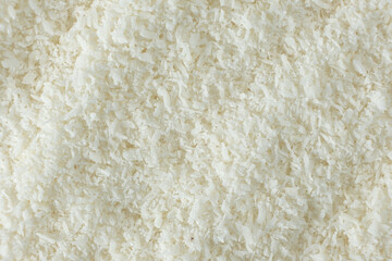 Fototapeta premium Macro Texture White Dried Coconut Flakes Top View