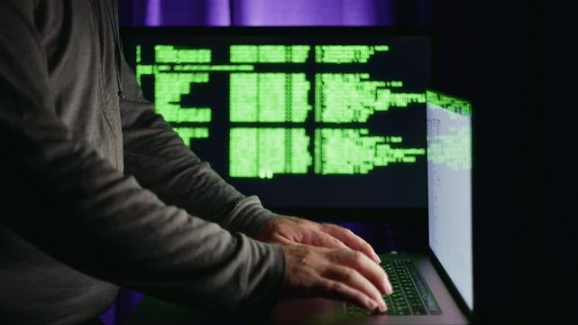 Cyber criminal launching malicious scripts in dark setup, cyber criminal exploiting system weaknesses, cyber criminal orchestrating digital attacks, designed for cyber threat awareness education