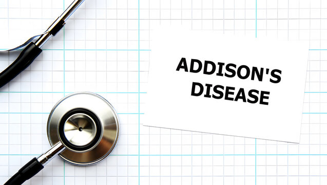 Stethoscope and paper with Addison's Disease text on grid background medical healthcare