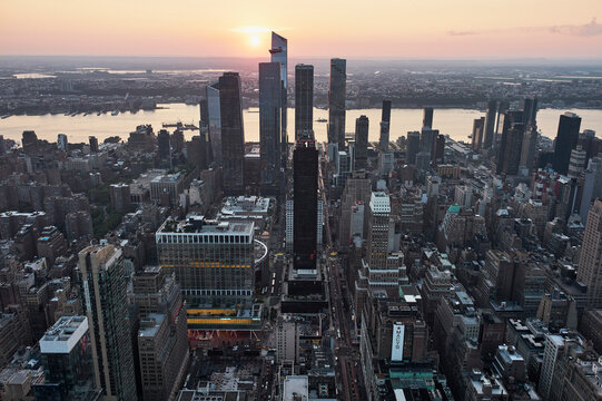 Aerial view of New York City skyline during sunset with tall skyscrapers. Manhattan, New York, USA