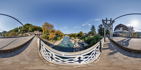 full seamless 360 hdri panorama on metal bridge over shallow mountain river in a small Georgian town with in equirectangular spherical projection. VR  AR content
