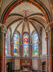 Fototapeta premium Semur-En-Auxois, France - 10 21 2025: Collegiate Church of Notre-Dame. Detail view of the Saint-Eloi chapel the commemorative chapel for the victims of the First World War with stained glass windows c
