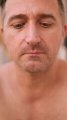 Obraz premium Vertical photo Person concentrates on chin hair while looking into mirror during morning calm, Man attentively examines his facial stubble in mirror as peaceful morning surrounds him temporarily