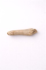 Single piece of weathered driftwood on a plain white background, natural texture, organic shape, coastal element
