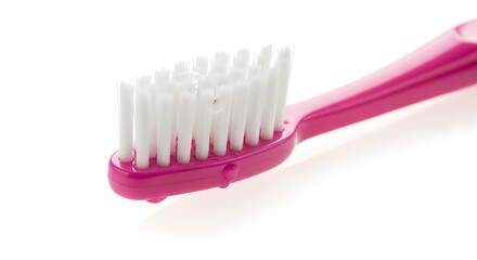 A pink toothbrush on white background