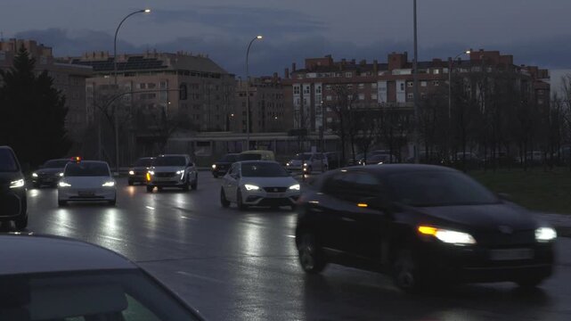 A busy street with many cars and a few buses