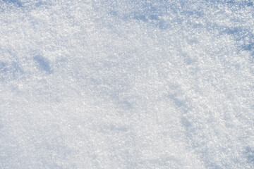 Obraz premium Natural snow texture with fine ice crystals creating a clean winter background. Minimal surface with copy space suitable for seasonal design, cold climate concepts and abstract winter visuals. 