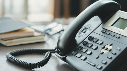 Landline phone on desk in office