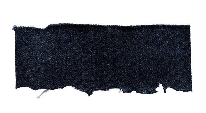 Torn dark denim fabric strip with frayed edge, cut out