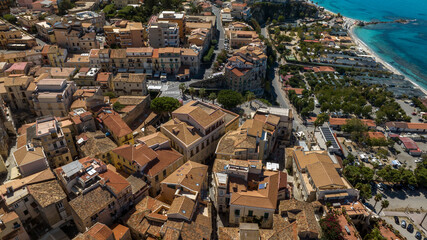 Fototapeta premium Aerial view of the historic center of Tropea, Calabria, southern Italy. It is a small town in the province of Vibo Valentia and a famous tourist destination overlooking the Mediterranean sea.