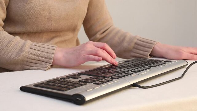 loud clicks of the space bar on a wired computer keyboard