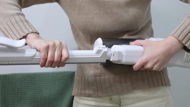 rustling, crunching, and thumping when connecting parts of a handheld corded vacuum cleaner