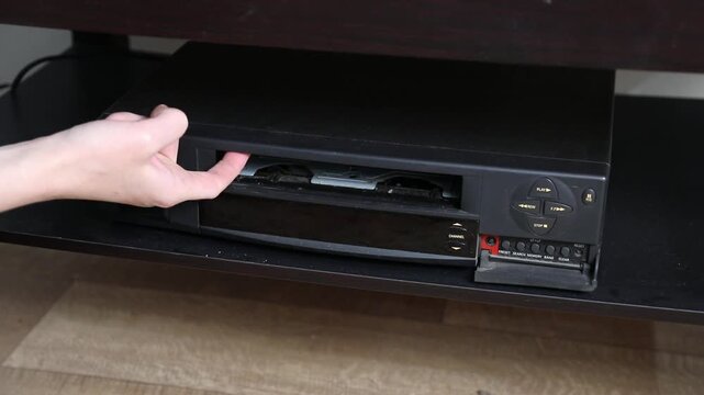 Knocks and thumps from the VCR's video cassette slot cover