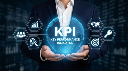 Fototapeta premium Businessman holding KPI Key Performance Indicator in futuristic blue glowing interface with business icons in modern corporate background for business analytics