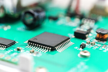 Close view of printed circuit board with electronic parts in a device