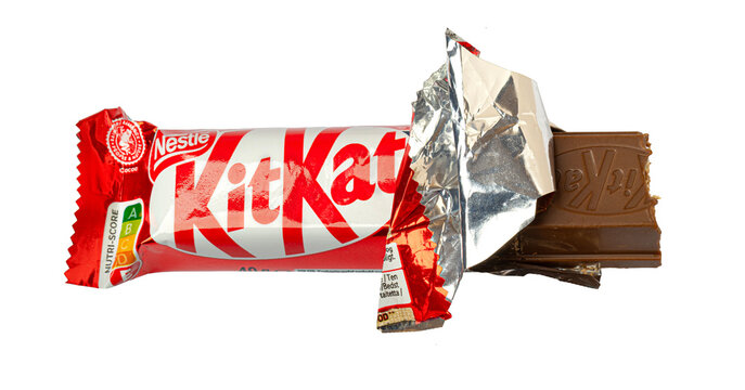 Kit kat chocolate bar with red wrapper on transparent background