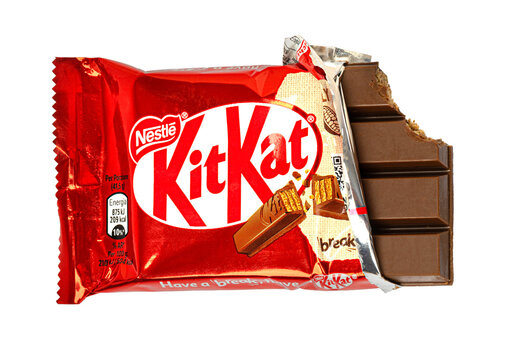 Kit kat chocolate bar with red wrapper on transparent background