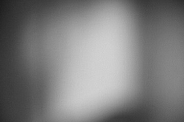 Monochrome abstract gradient texture with vintage film noise.