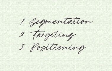 The word "STP" written on notebook.The word is short term of "Segment""Target" and "Position". In level angle. Close up.