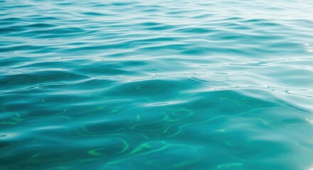 Deep turquoise seawater texture rolling gently under bright sunlight. Focus on clean, clear water and natural aquatic movement, fresh, surface, fluid