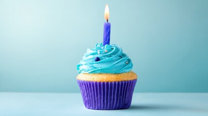 cupcake. A solitary birthday cupcake topped with frosting and a candle, set against a soft pastel backdrop. symbolizing life milestones and joyful moments.
