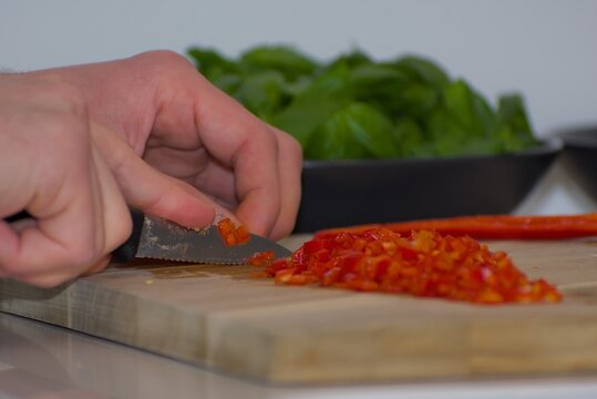Finely Diced Red Chili Pepper on Wood Board