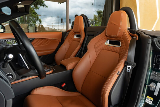 Jaguar F-Type interior brown leather sports seats, Luxury sports car cabin with performance bucket seats