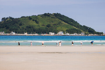 Jeju Island, Hyeopjae Beach, Hallim, white sand beach and sea, Hallim-ro, Hallim-eup, Geumneung Beach, Jeju-do, South Korea, Jeju Province, landscape view in a sunny day, and Biyangdo island © tsuguliev