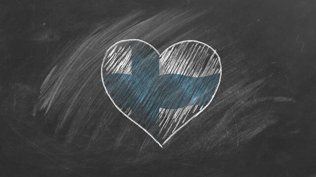 National flag of Finland in heart shape  drawn with colored chalk on a blackboard. Finnish language, learning Finnish.